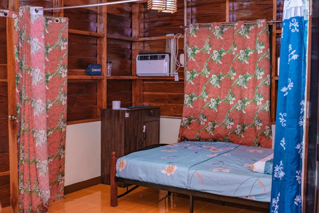 Postel nebo postele na pokoji v ubytování Ana's Bungalow