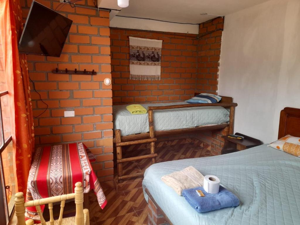 Postel nebo postele na pokoji v ubytování Casa Hospedaje"Los Capulies"
