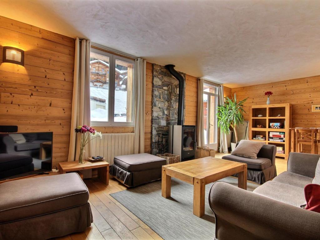 a living room with a couch and a table at Chalet Plagne 1800, 6 pièces, 12 personnes - FR-1-455-238 in La Plagne Tarentaise