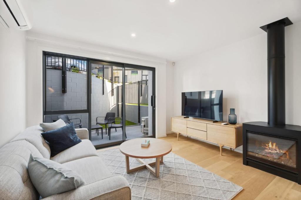 a living room with a couch and a fireplace at Rivers Retreat in Albert Town