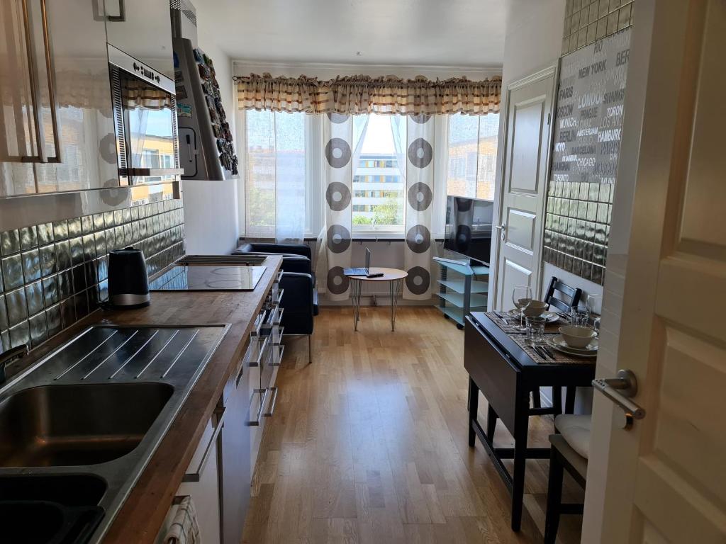 a kitchen with a sink and a counter top at Masthugget in Gothenburg