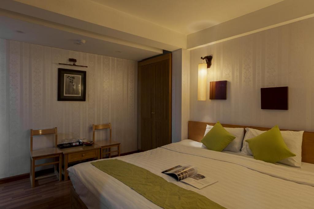 Postel nebo postele na pokoji v ubytování Hanoi Central Park Hotel