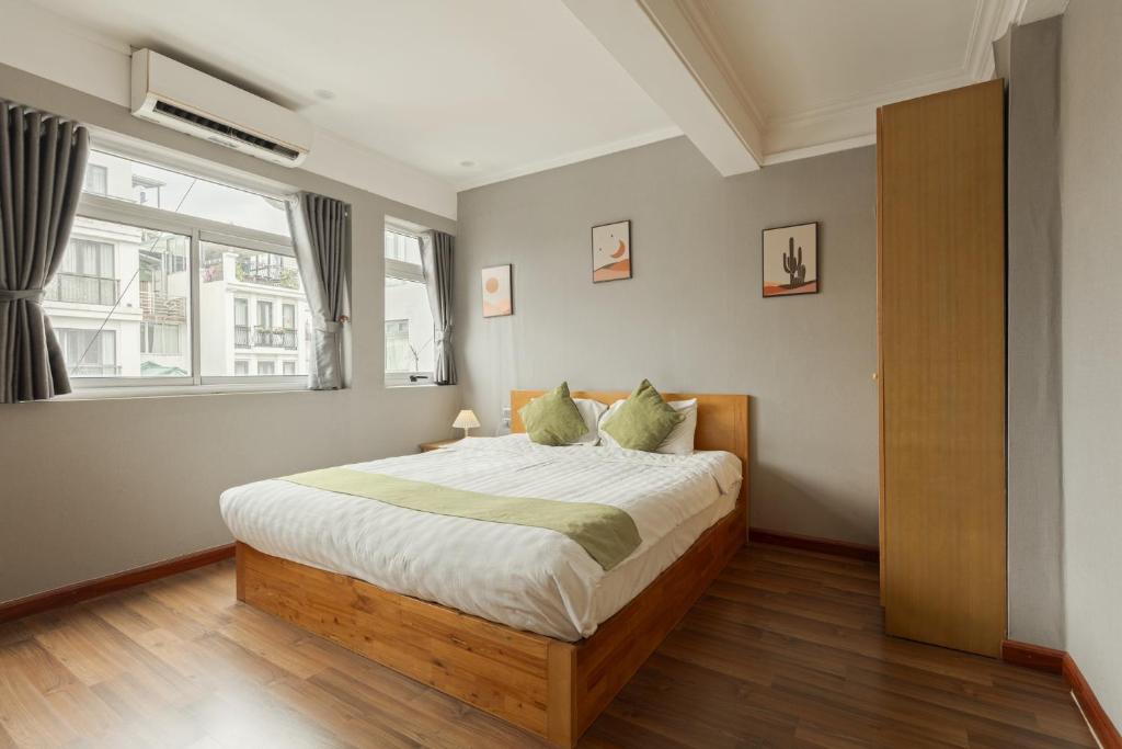 Postel nebo postele na pokoji v ubytování Hanoi Central Park Hotel