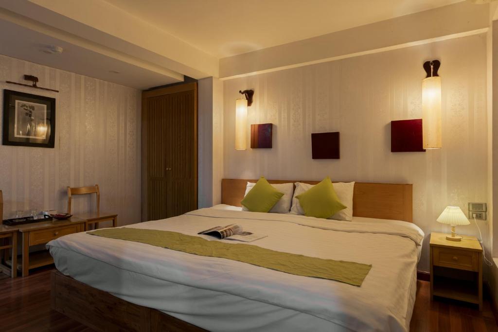 Postel nebo postele na pokoji v ubytování Hanoi Central Park Hotel