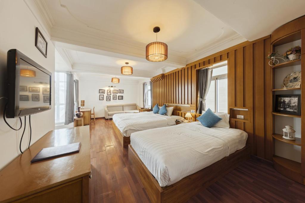 Postel nebo postele na pokoji v ubytování Hanoi Central Park Hotel