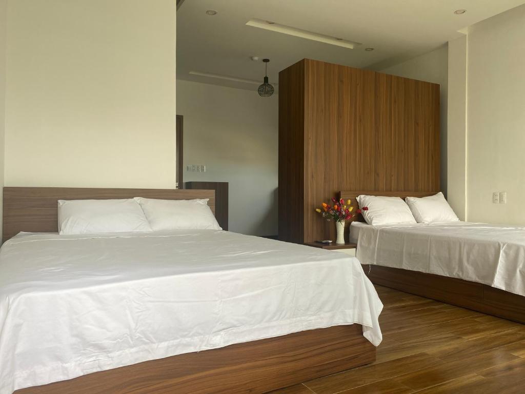 Postel nebo postele na pokoji v ubytování Tree Homestay