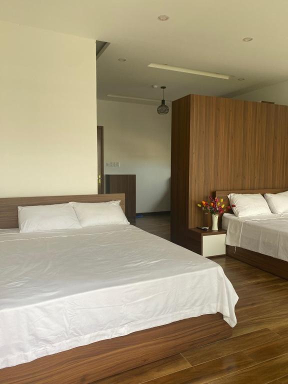 Postel nebo postele na pokoji v ubytování Tree Homestay