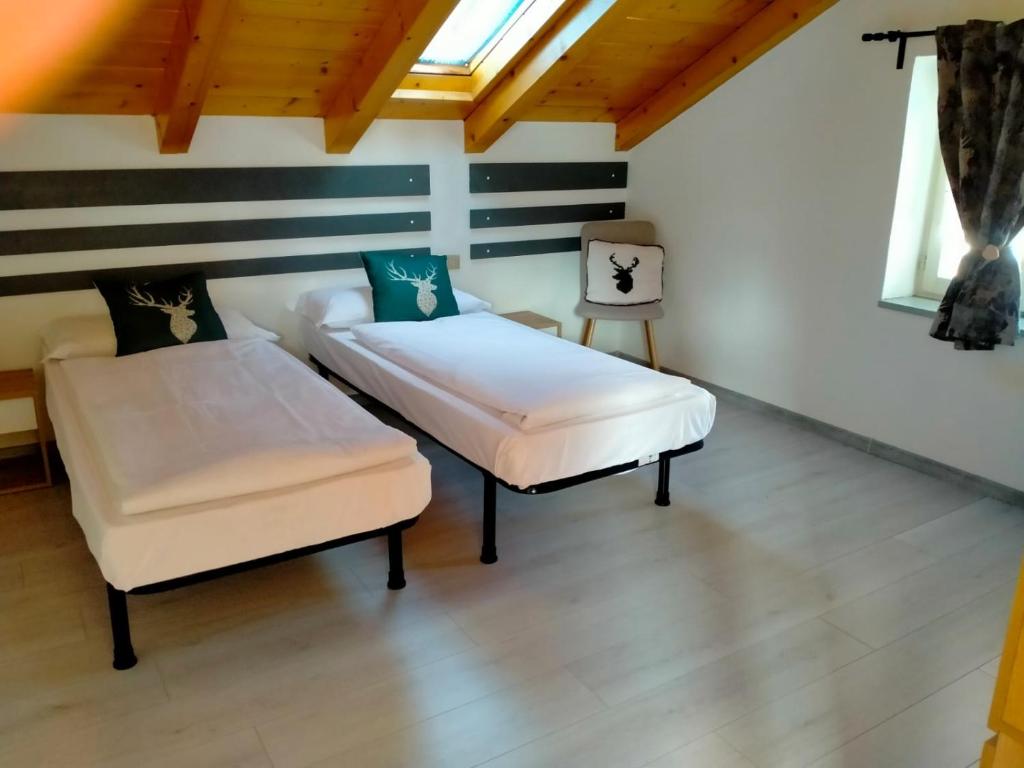 Posteľ alebo postele v izbe v ubytovaní Garnì Belvedere