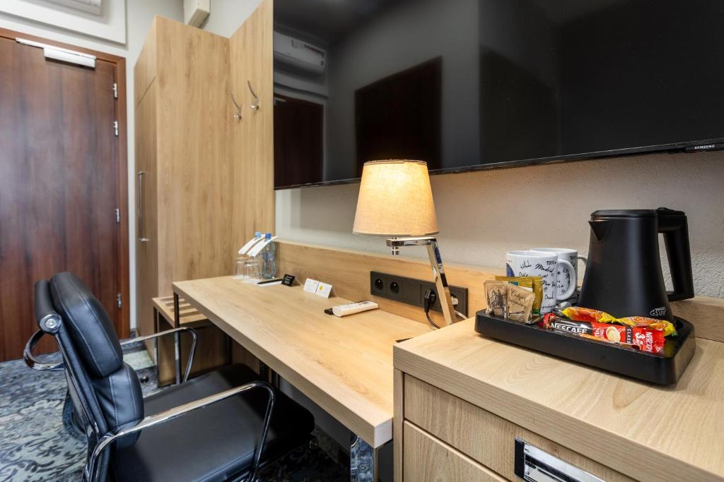 Kuchyň nebo kuchyňský kout v ubytování Apartamenty Browar Luxury Old Town Poznań 24h