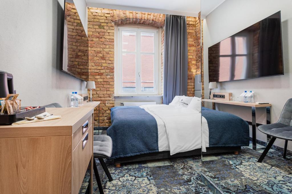 Postel nebo postele na pokoji v ubytování Apartamenty Browar Luxury Old Town Poznań 24h