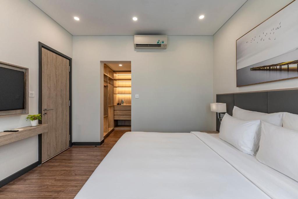 Postel nebo postele na pokoji v ubytování Garden View Court Suites Ho Chi Minh City