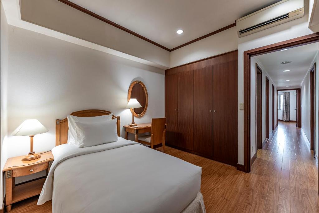 Postel nebo postele na pokoji v ubytování Garden View Court Suites Ho Chi Minh City