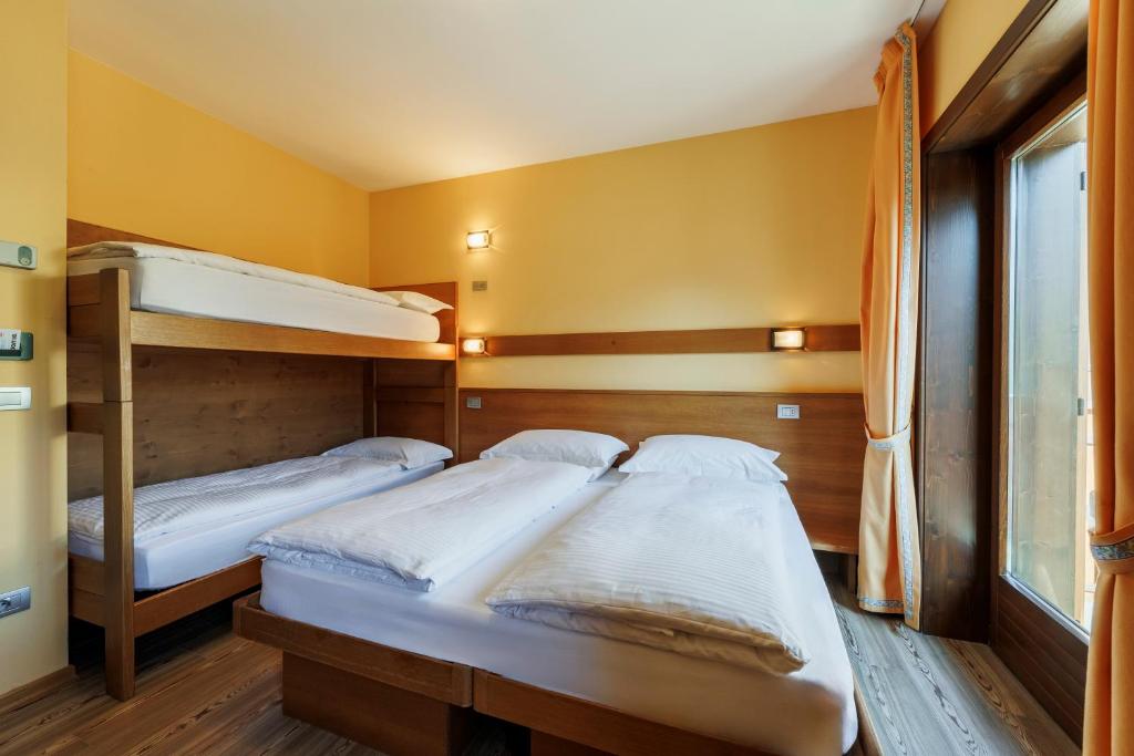 Postel nebo postele na pokoji v ubytování Hotel Miravalle
