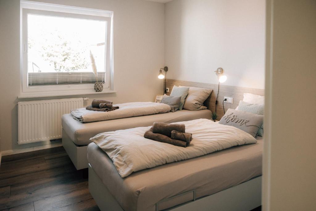 Postel nebo postele na pokoji v ubytování Primesurf House Fehmarn
