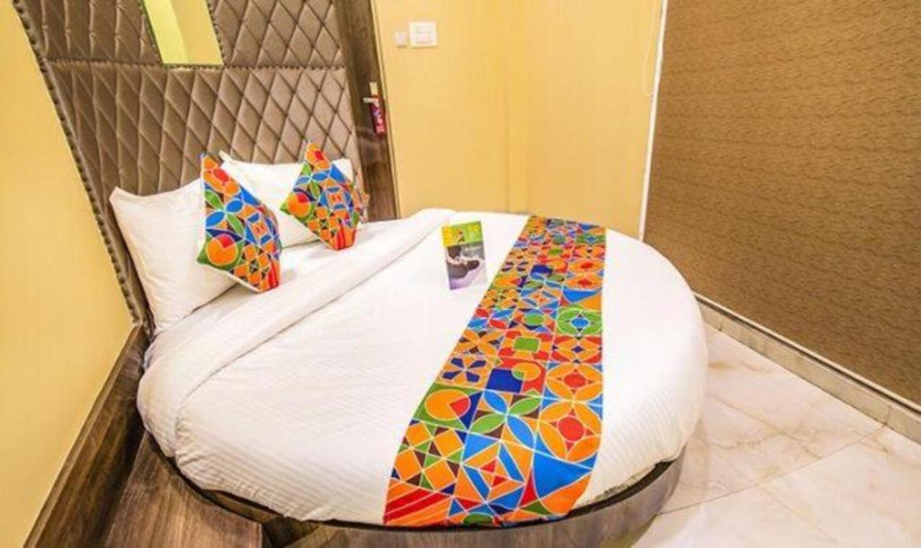 a bed in a room with at FabHotel Seven Hills in Mumbai