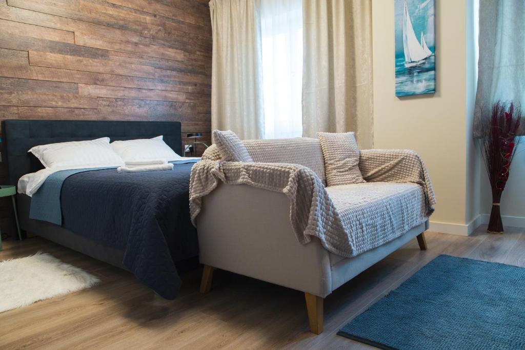 Giường trong phòng chung tại Konstanzer 95 - 1 camera, bucaterie, aer conditionat, masina de sopalat