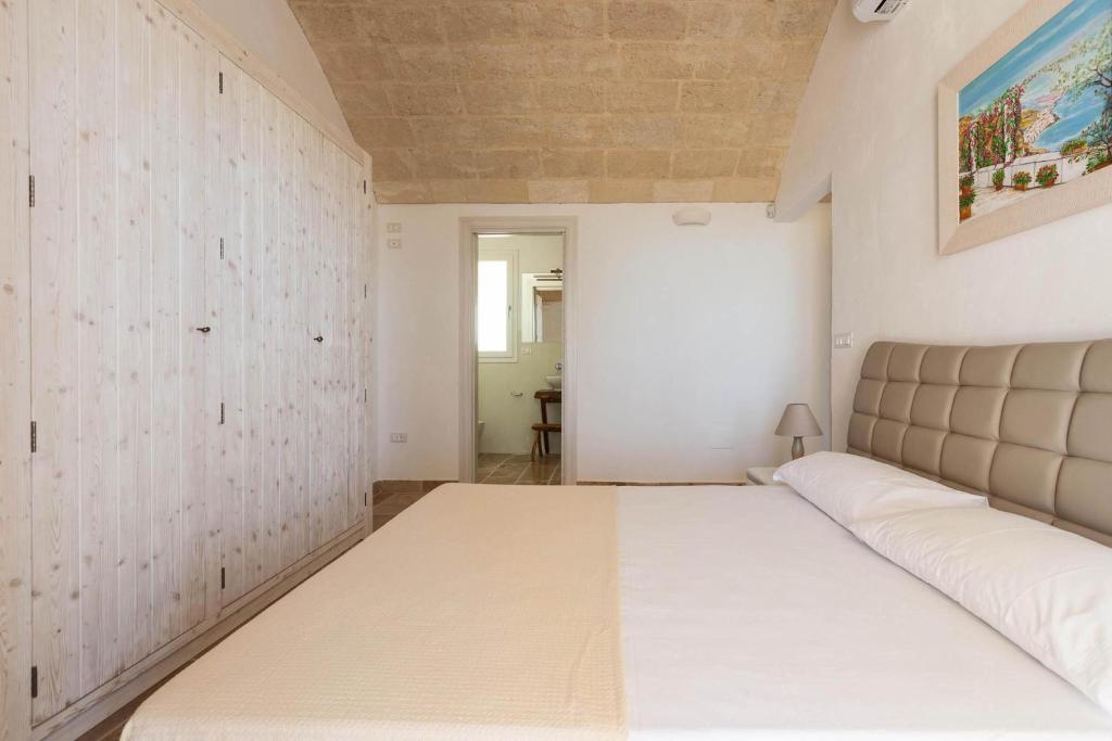 Postel nebo postele na pokoji v ubytování La Serrazza by Perle di Puglia