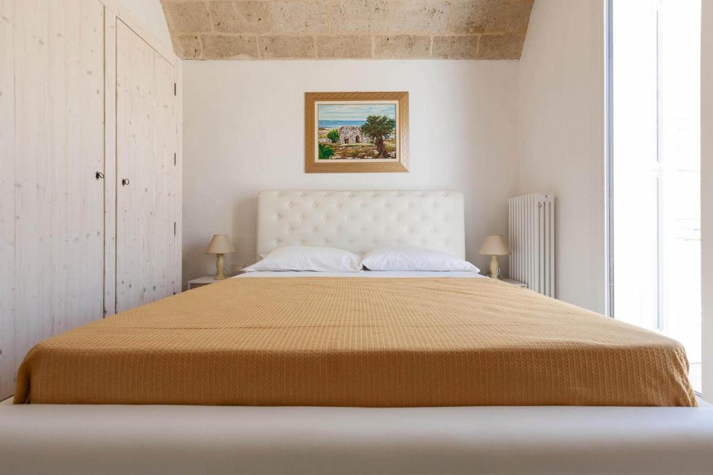 Postel nebo postele na pokoji v ubytování La Serrazza by Perle di Puglia