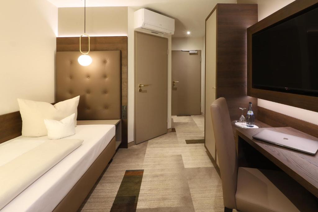 Postel nebo postele na pokoji v ubytování Hotel Goldene Rose