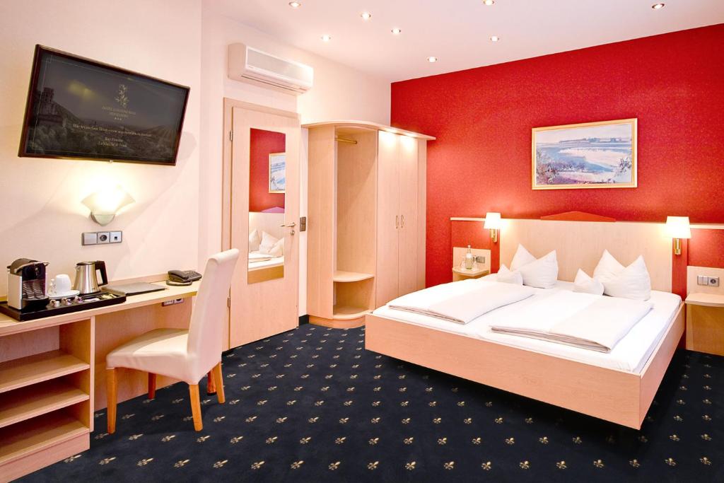 Postel nebo postele na pokoji v ubytování Hotel Goldene Rose