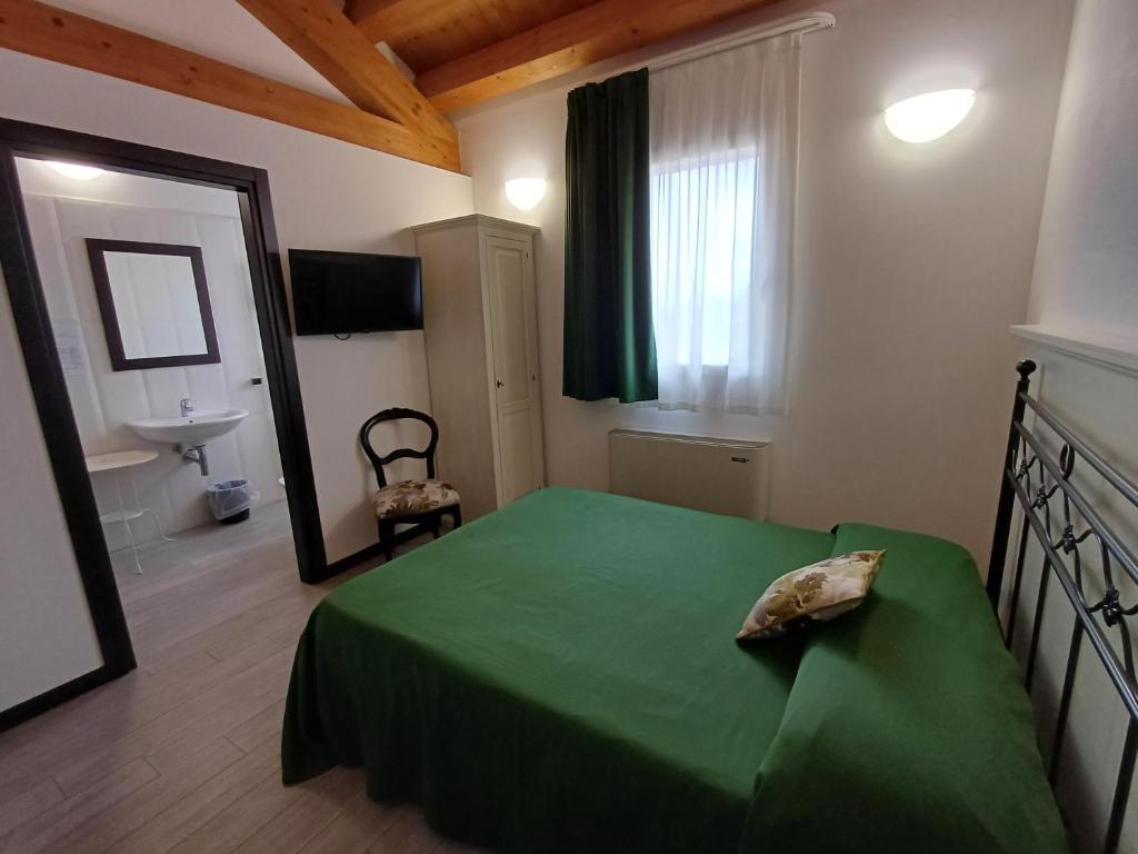 Postel nebo postele na pokoji v ubytování Arneroni