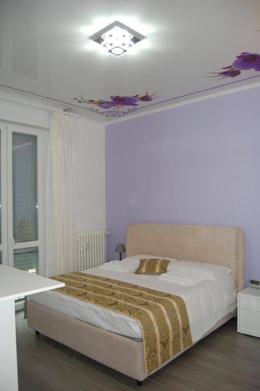 Posteľ alebo postele v izbe v ubytovaní Orchidea