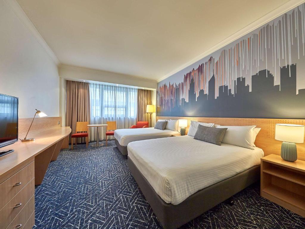 Postel nebo postele na pokoji v ubytování Mercure Perth