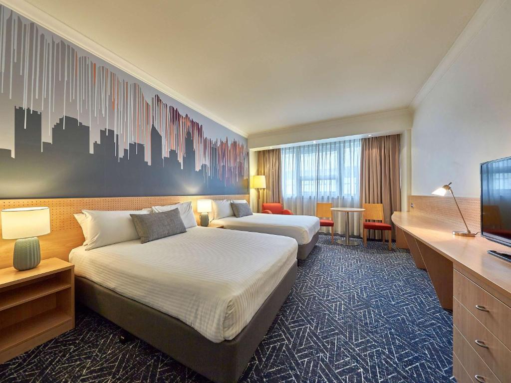 Postel nebo postele na pokoji v ubytování Mercure Perth