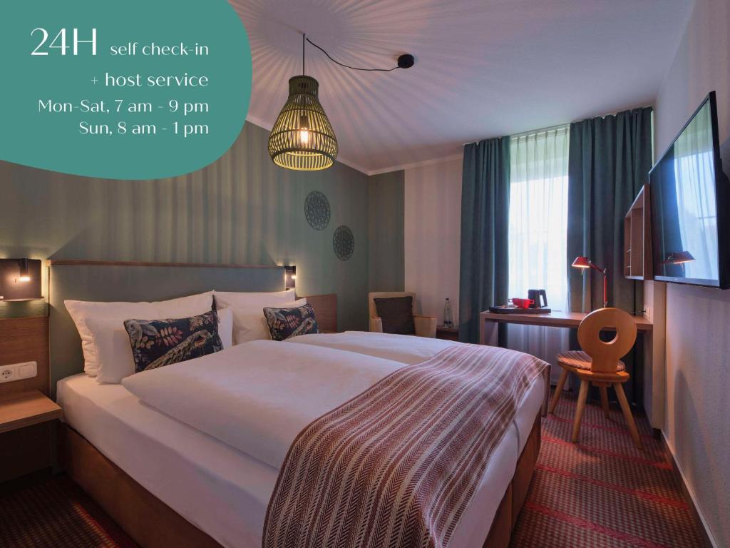Giường trong phòng chung tại Classik Hotel Martinshof, Messe München