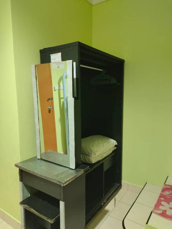 Postel nebo postele na pokoji v ubytování Borneo Gaya Lodge