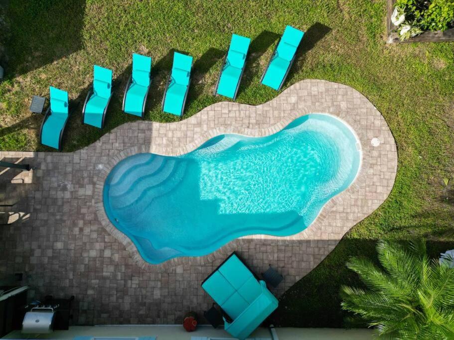 an overhead view of a swimming pool with a heart shaped painting at Relaxation Villa in Royal Palm Beach