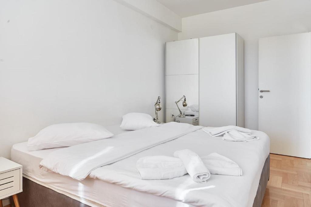 Postel nebo postele na pokoji v ubytování Urban Serviced Apartments