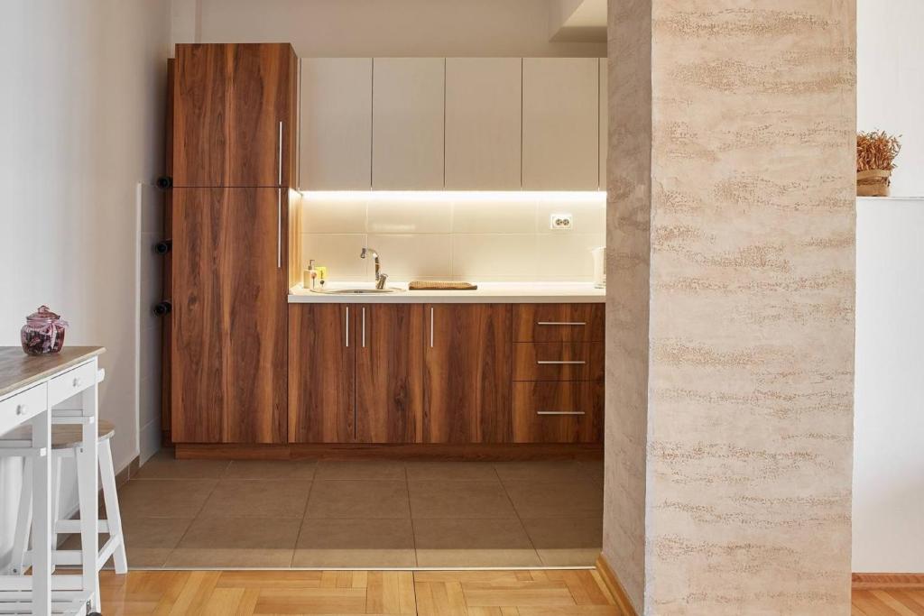 Kuchyň nebo kuchyňský kout v ubytování Urban Serviced Apartments
