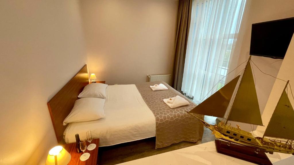 Postel nebo postele na pokoji v ubytování Riga Unimars Hotel