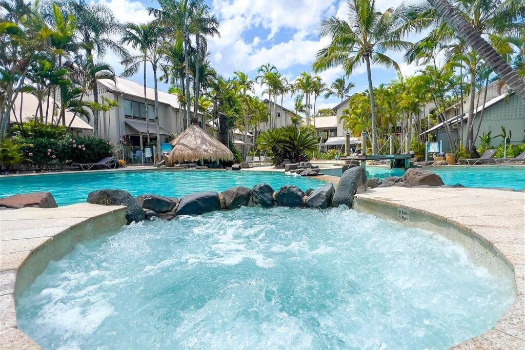 a large swimming pool with a large swimming pool at Noosaville Tropical Islander Resort in Noosaville