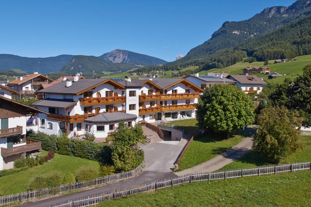 an aerial view of a resort with mountains in the background at Residence Viktoria in Castelrotto