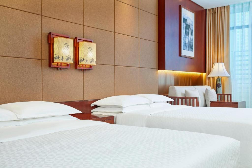 Postel nebo postele na pokoji v ubytování Four Points by Sheraton Danzhou