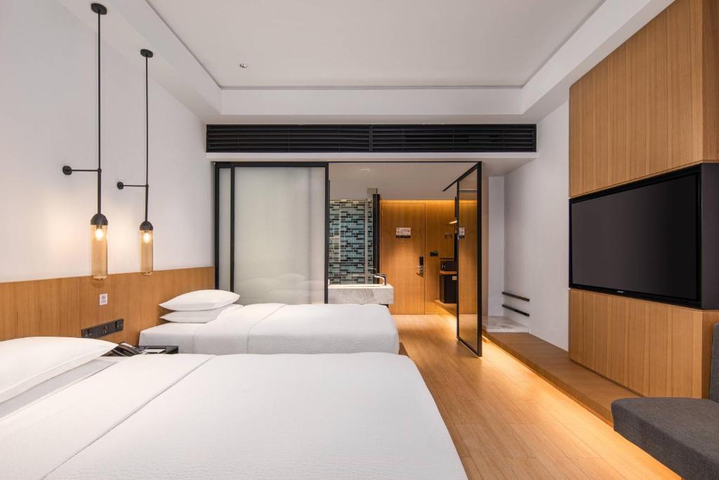 Postel nebo postele na pokoji v ubytování Fairfield by Marriott Jingzhou