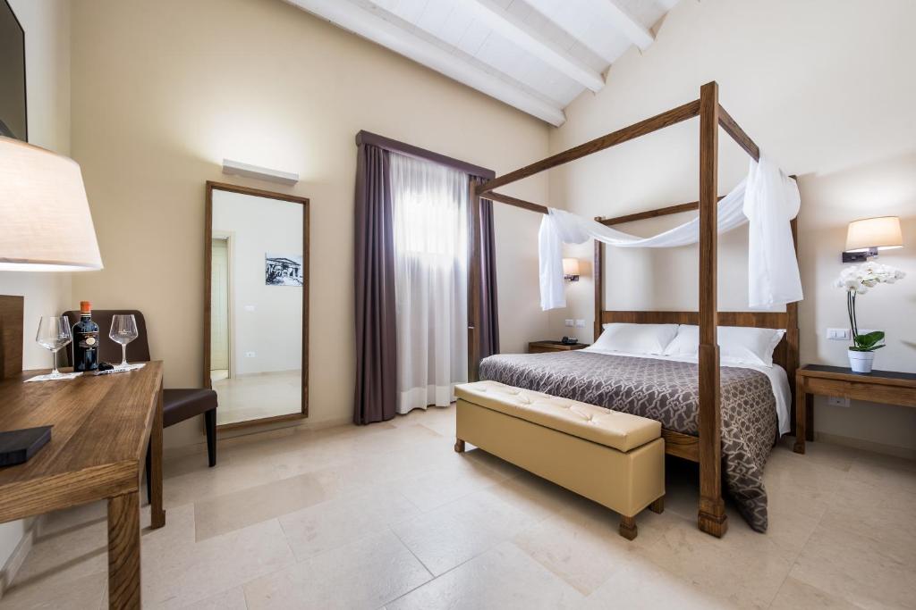 Postel nebo postele na pokoji v ubytování Firriato Hospitality - Baglio Sorìa
