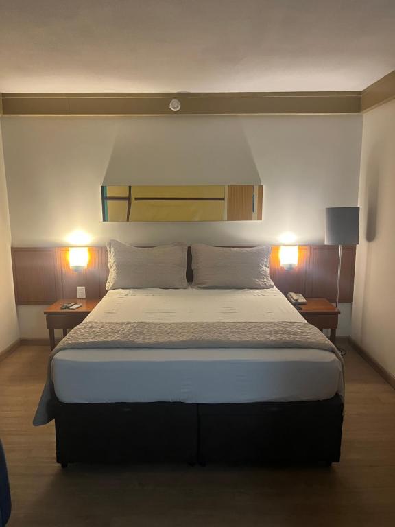 Ένα ή περισσότερα κρεβάτια σε δωμάτιο στο Flat VMariana PqIbirapuera Borges Lagoa com garagem 1105