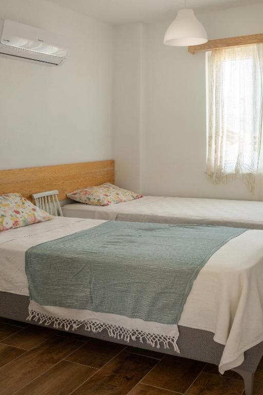 Postel nebo postele na pokoji v ubytování Masal Evimiz