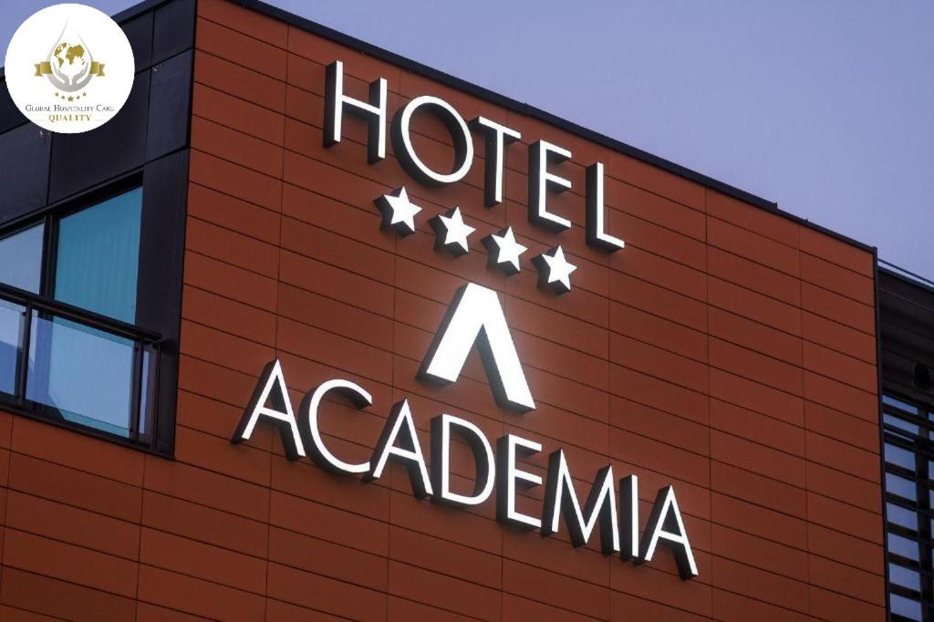 a hotel acardiana sign on the side of a building at Hotel Academia in Zagreb