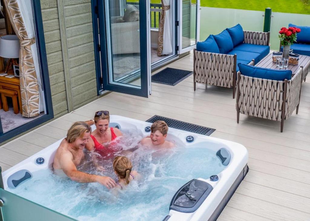 a group of people in a jacuzzi tub at Heathergate Boutique Holiday Park in Hexham