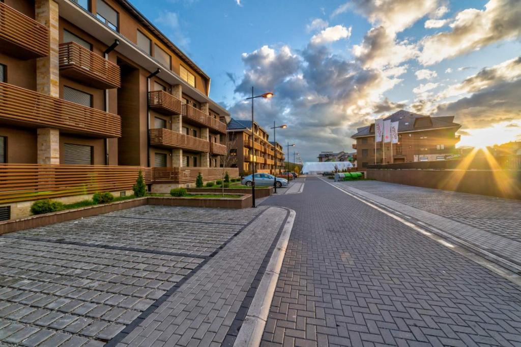 an empty street in a city with buildings at Luxury Kalman Centar Apartmani in Zlatibor