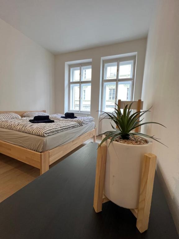 Postel nebo postele na pokoji v ubytování Apartmány Soukenická