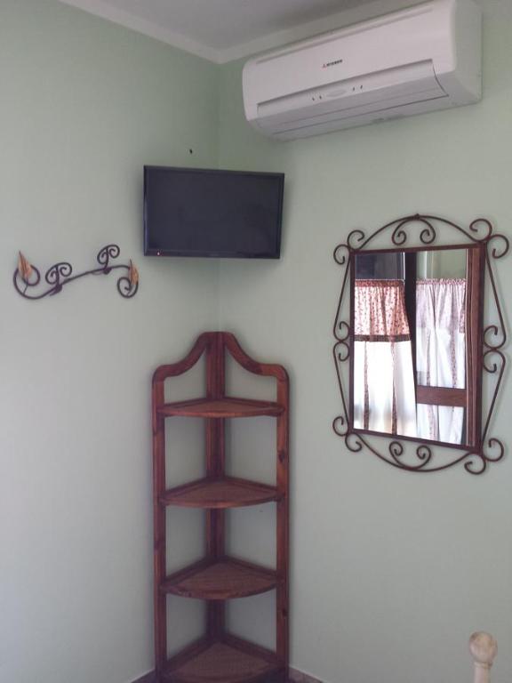 Телевизор и/или развлекательный центр в Agriturismo Donna Beatrice