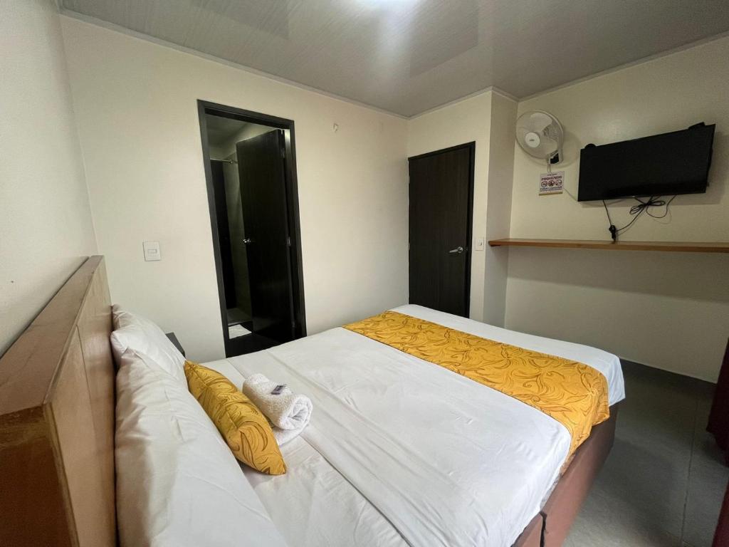 Postel nebo postele na pokoji v ubytování Hotel Olam Confort