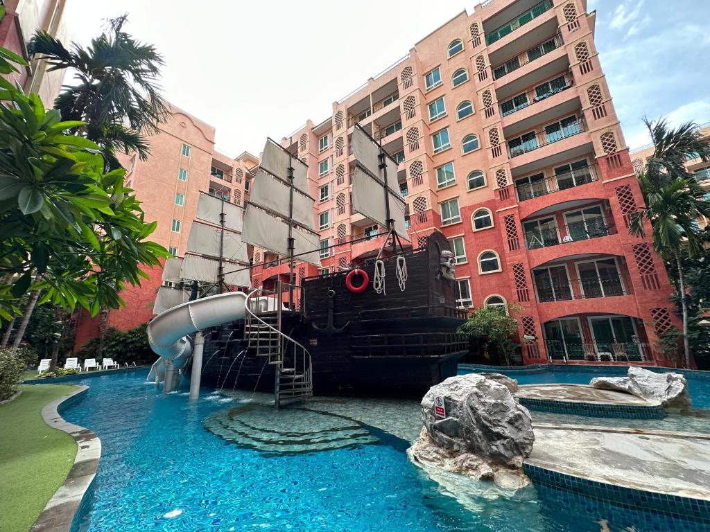 a water slide in front of a building at Seven Seas Condo Pattaya - 7 seas pool view in Jomtien Beach