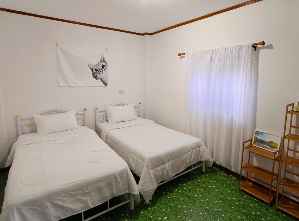 Postel nebo postele na pokoji v ubytování Tiki Bar-KanTiang Guesthouse