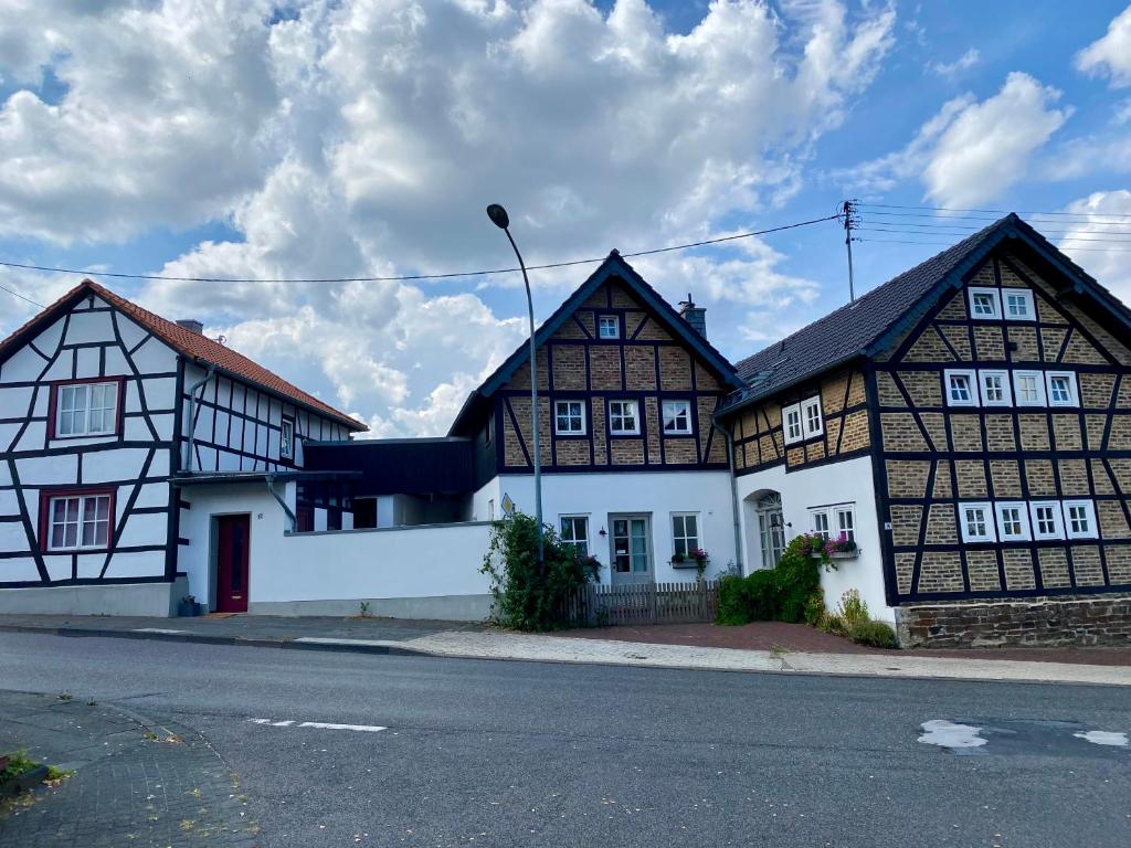a group of buildings on the side of a street at eichHAUS Eifel in Rheinbach